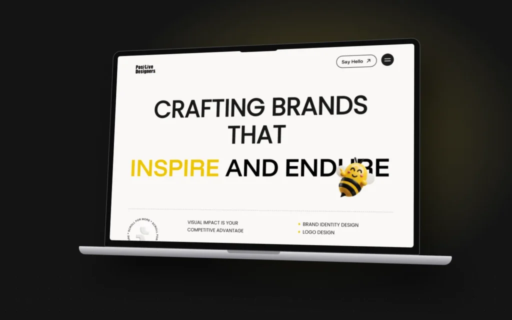 Positive Designers website shown on a laptop